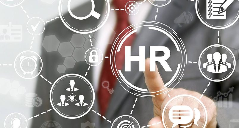 HR-professional-presses-HR-icon-on-a-virtual-screen-a-concept-of-what-HR-solutions-are